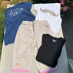 Set of 4 items for your little girl that wears 4t 4/5. Cute khaki pants, 3 tops.